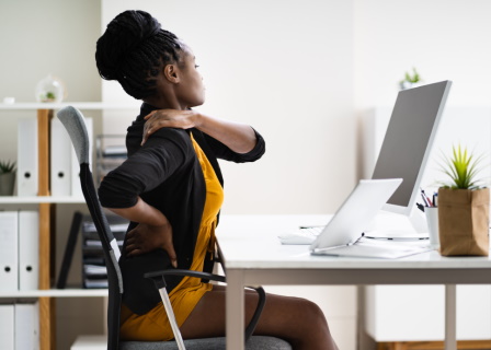 Back Pain Bad Posture Woman Sitting In Office Scene