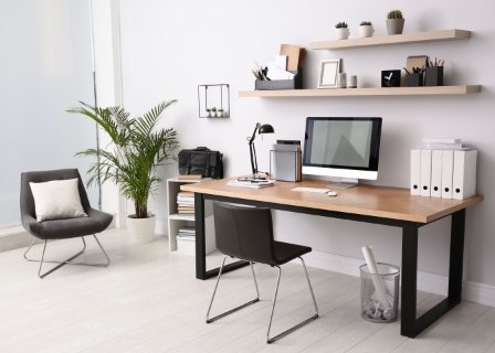 home office with minimalist design, there are floating shelves with decoration above the desk