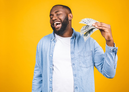 man fanning himself with money