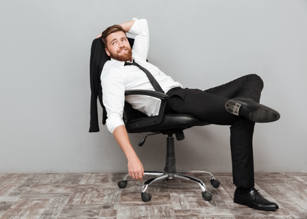 Man relaxing in office chair