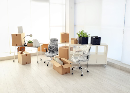 side view of a packed up office and wrapped chairs