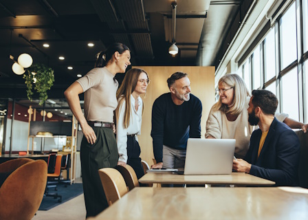 office workers collaborating around table