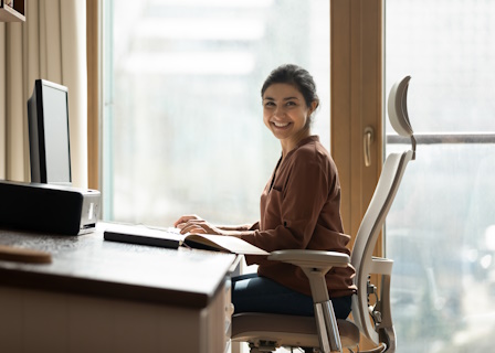 woman sitting in ergonomic office chair