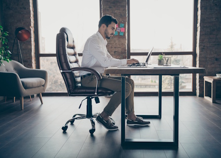 man sitting on office chair working