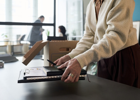 woman packing office desk