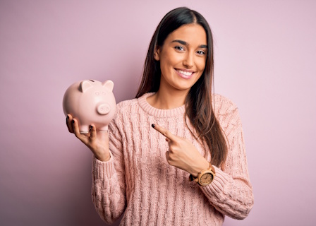 woman holding piggy bank