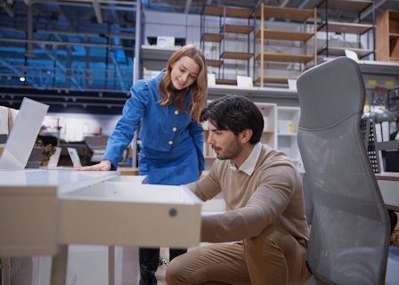 man inspecting desk