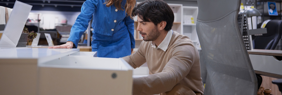 man inspecting desk