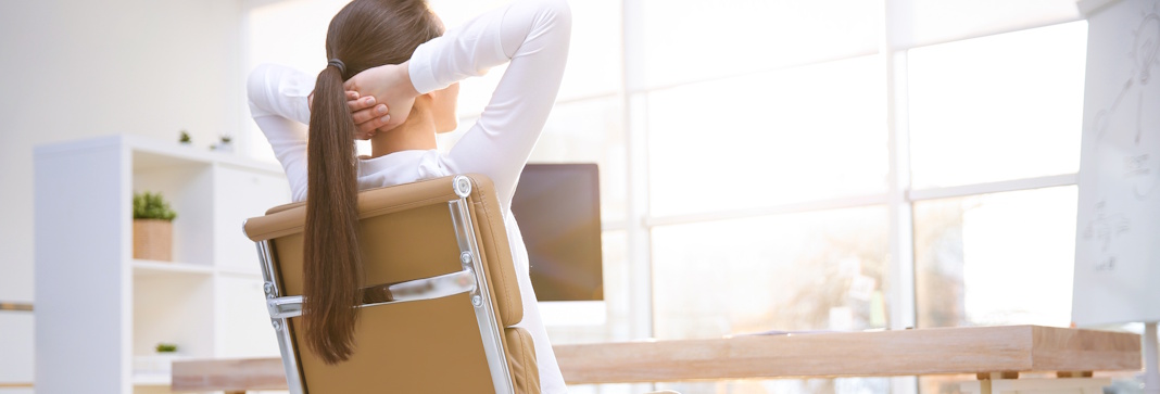 woman relaxing in office chair