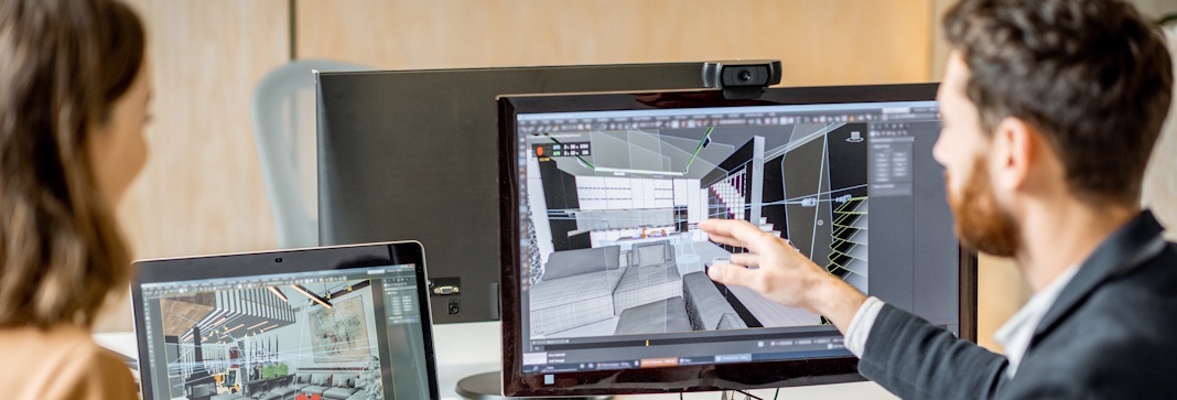 office designers reviewing plans on computer