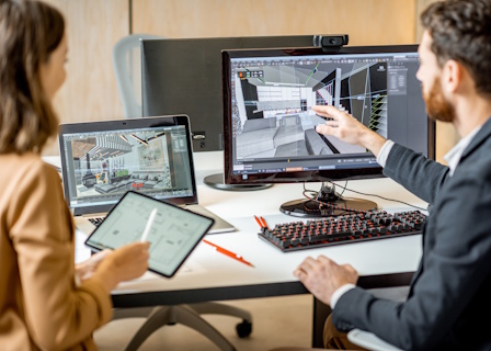 man inspecting desk office designers reviewing plans on computer small