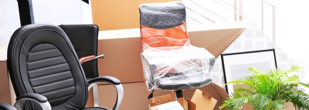 Unpacking cardboard boxes in a new office