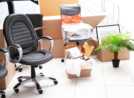 Unpacking cardboard boxes in a new office Unpacking cardboard boxes in a new office