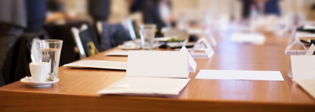 businesspeople around the table in conference room